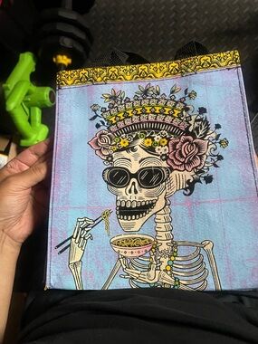 Blue Q Skull with Floral Crown on Blue Background